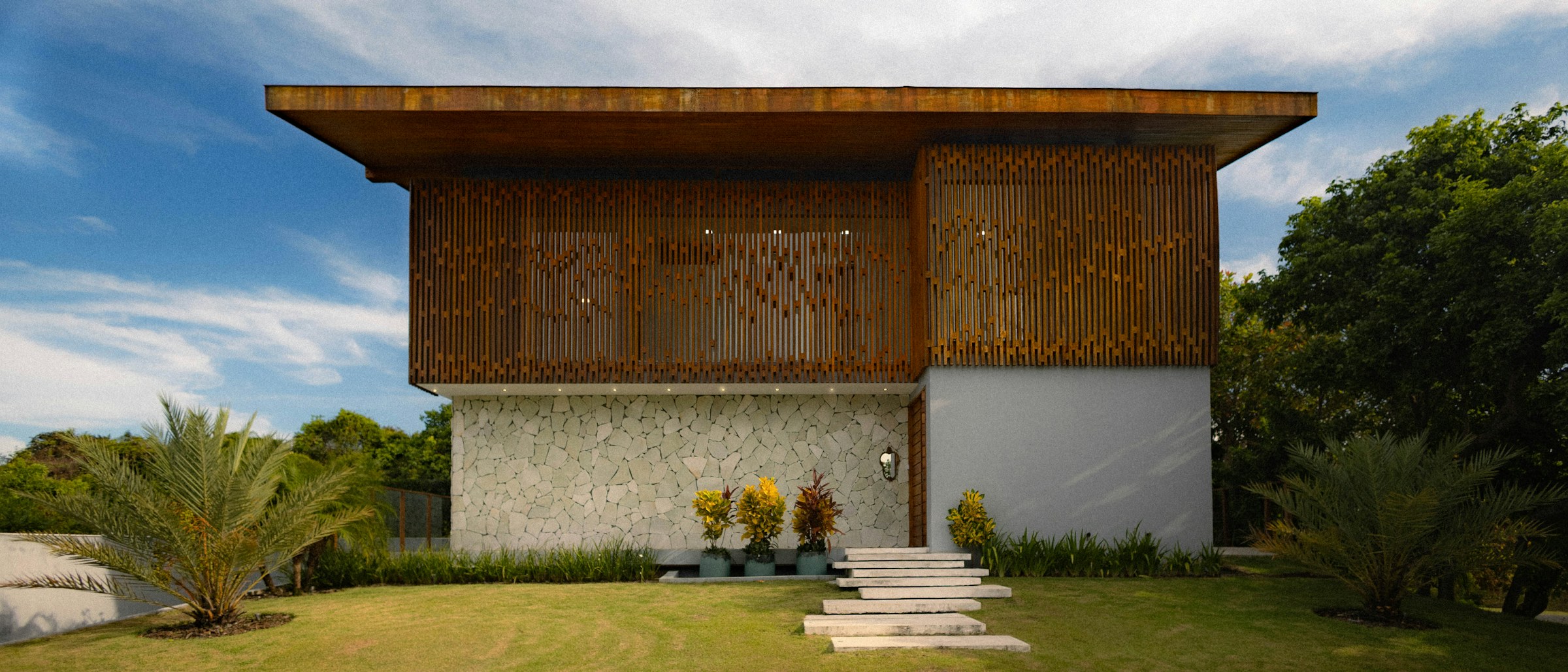 Contemporary timber-and-stone building set in a green landscape